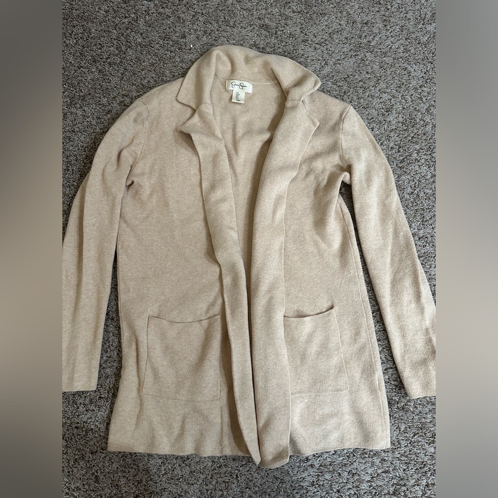 Sweater/jacket, professional or business casual.